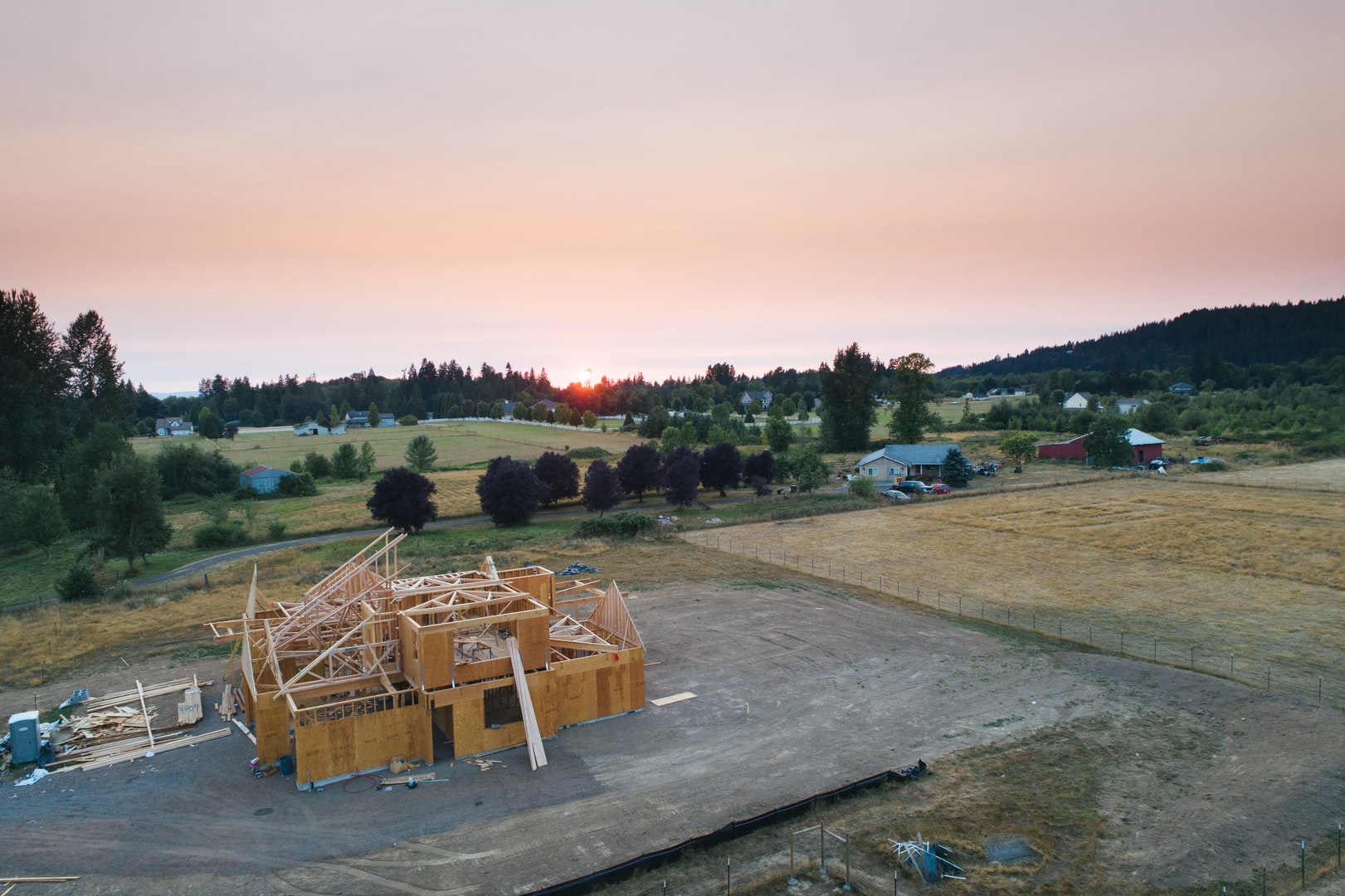 New home framing at sunset